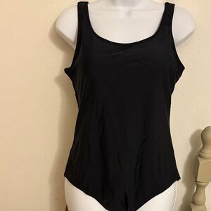Black swimsuit with crisscross straps in back. NWOT.